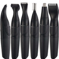 Black grooming kit with six interchangeable trimmer heads