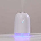 White spray humidifier with soft blue light