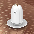 White desktop spray humidifier on a saucer