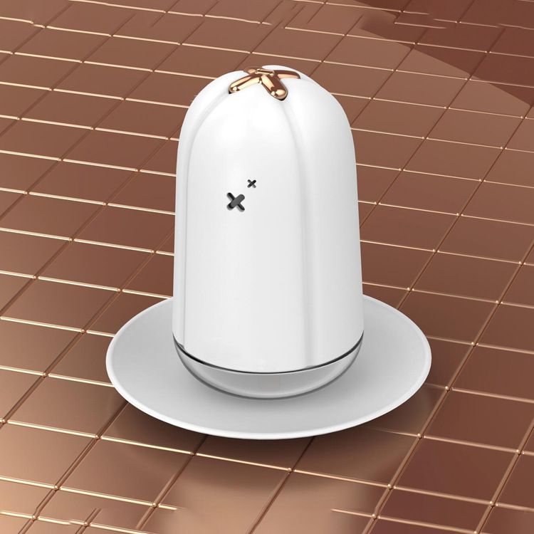 White desktop spray humidifier on a saucer