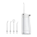 White cordless water flosser with four interchangeable nozzles
