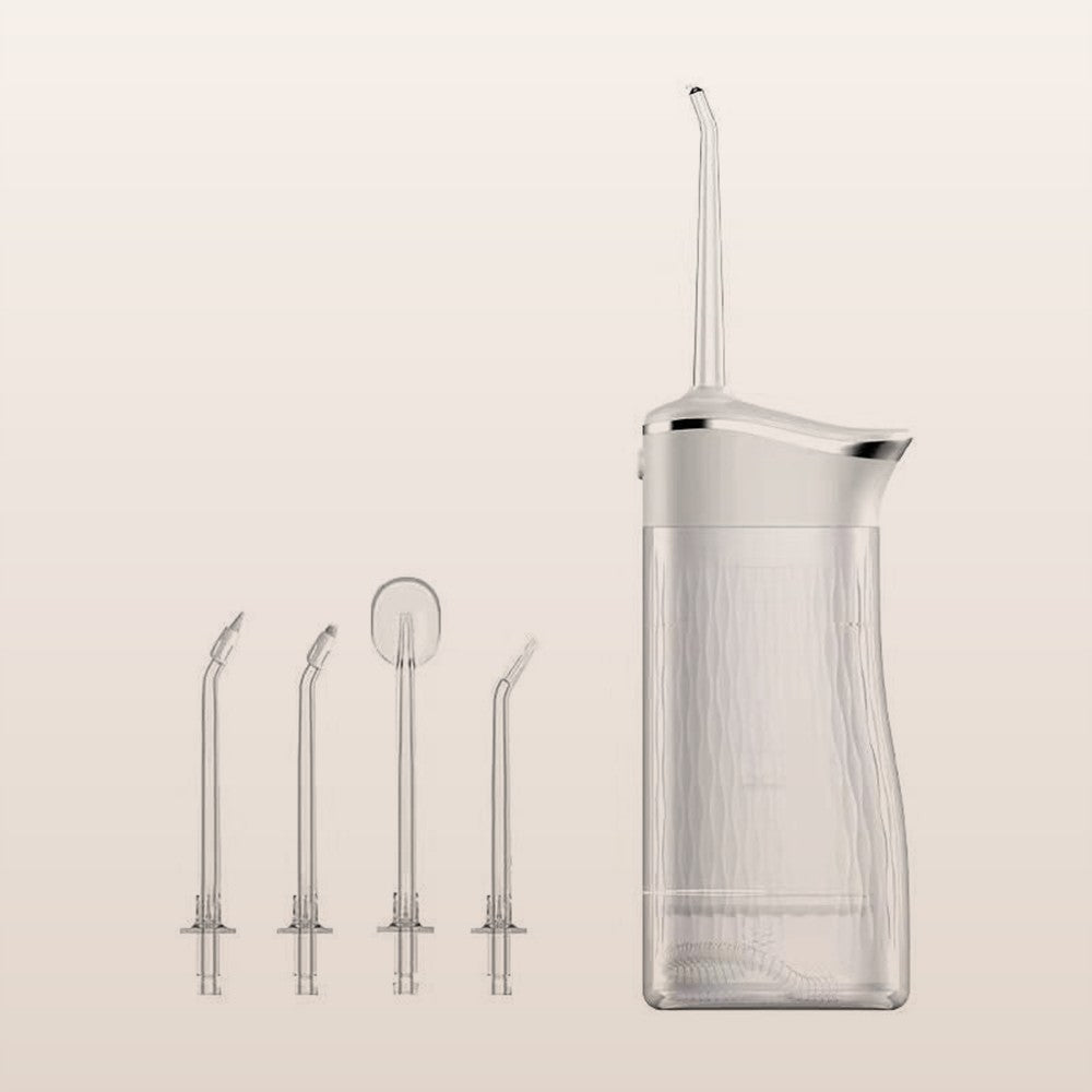 Portable cordless water flosser with four nozzles on a soft neutral background
