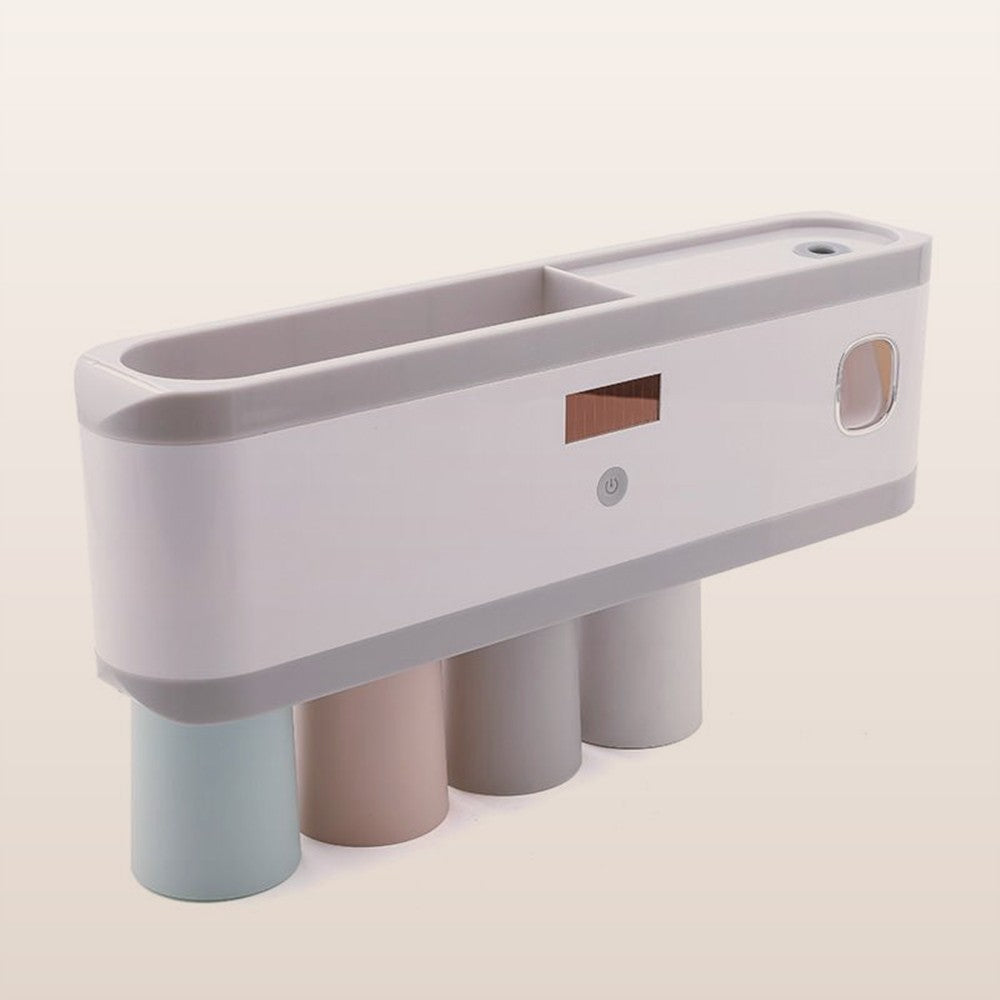 Wall-mounted toothbrush holder with toothpaste dispenser on a neutral background