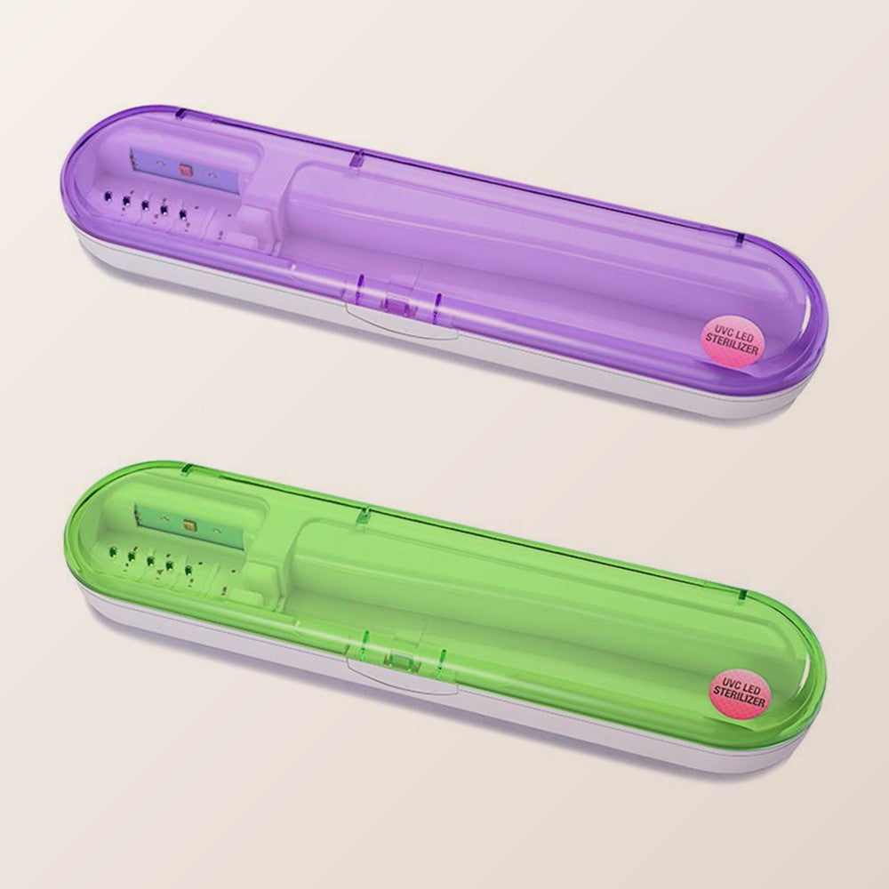 Purple and green toothbrush travel cases on a neutral background