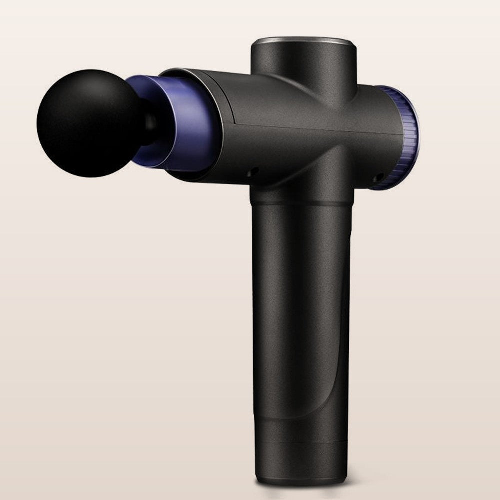 Black handheld massage gun on a warm neutral background