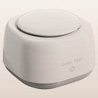 Mini ultrasonic cleaner on a warm neutral background